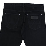 กางเกงยีนส์ผู้ชาย VEGAS FIT เอวกลาง ทรงรัดรูป สีดำ